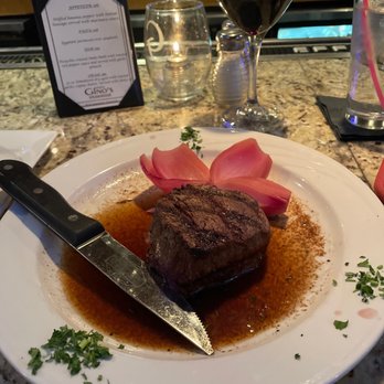 Gino's Steakhouse - a steak on a plate with a knife - Steakhouses Near Me - Merrillville, Indiana Gino's Steakhouse - a steak on a plate with a knife - Steakhouses Near Me - Merrillville, Indiana