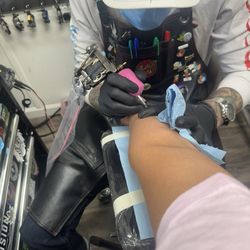 Hybiscus Tattoo and Piercing