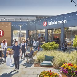 The Village at Corte Madera - Shoppers gather outside lululemon in a flower-filled courtyard at The Village at Corte Madera.