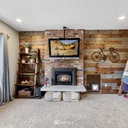 San Tan Valley Handyman - Full room remodeled. Installed can lights, contrast wall, fireplace installation and flooring by San Tan Valley Handyman