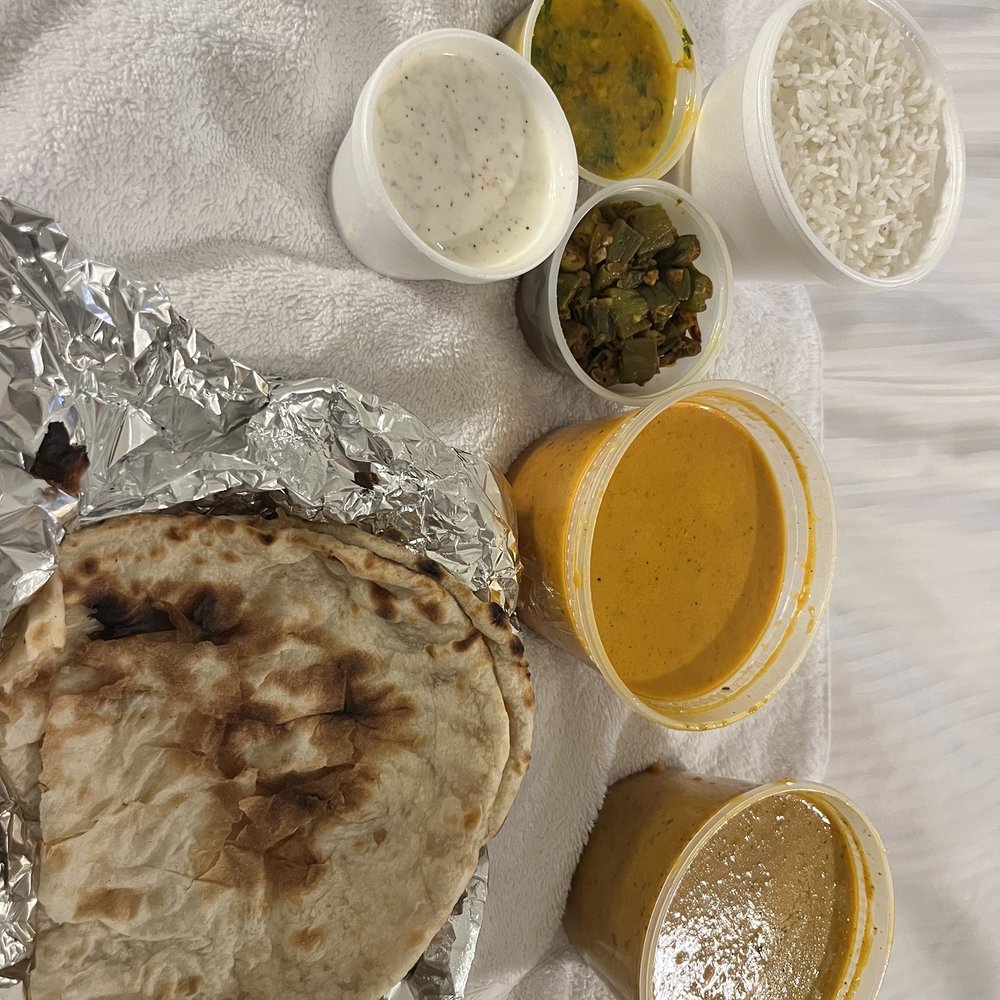 Chicken tikka masala, rice, Raita, vegetable of the day, lentil, naan, lamb korma.