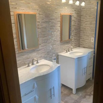 Scott Construction - a bathroom with two sinks and mirrors - General Contractors Near Me - Waterloo, New York