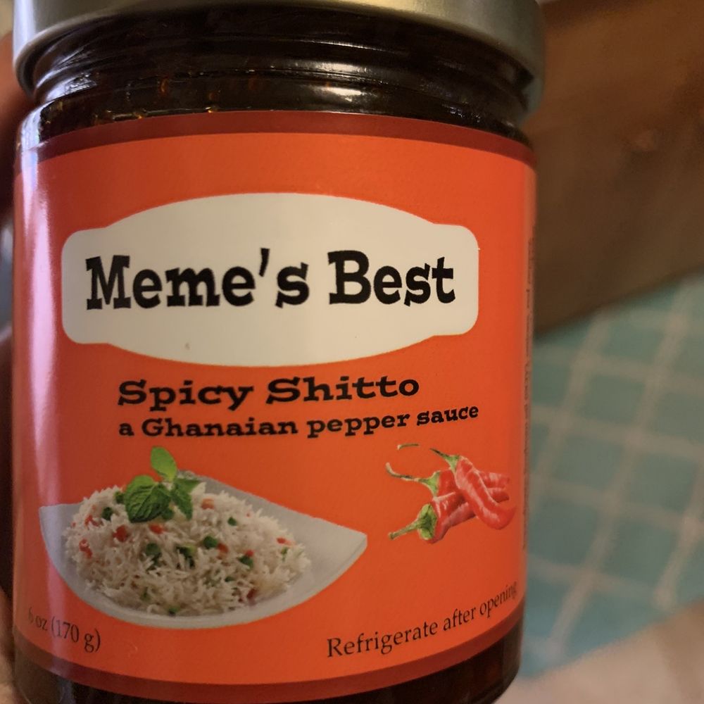 West African Market - a hand holding a jar of meme's best - International Grocery Near Me - Seattle, Washington