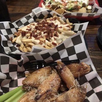 The Loft Bar & Grill - Nachos, loaded fries, garlic Parmesan chicken wings - Bars Near Me - Crystal River, Florida