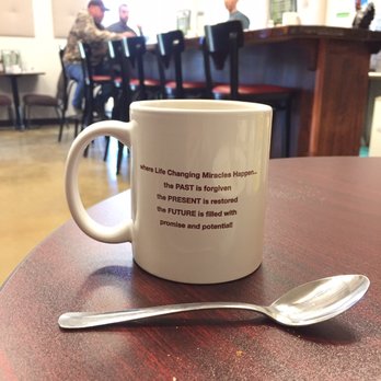 Dix Ave Diner - a coffee cup with a spoon on a table - Breakfast & Brunch Near Me - Queensbury, New York