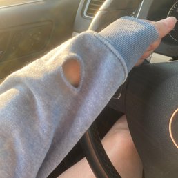 Rip from pulling my sleeve down when it was rolled up on my left arm.