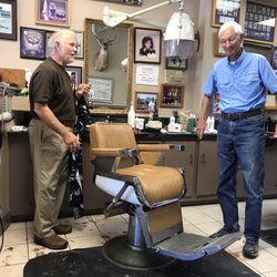 Hulon's Barber & Style Shop - Preparing to practice his craft