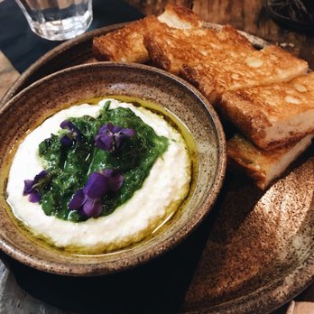 Foraged. A Hyper Seasonal Eatery - Garlic, currant, candied lemon, and ricotta spread with crispy baguette. Divine. - New American Near Me - Baltimore, Maryland