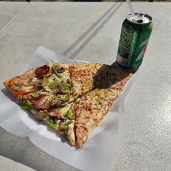 3 Bros Pizza - a slice of pizza and a can of soda - Pizza Near Me - Astoria, New York 3 Bros Pizza - a slice of pizza and a can of soda - Pizza Near Me - Astoria, New York