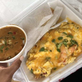 Flavor Table - Grits with étouffée sauce on top with the shrimp scramble - Cajun/Creole Near Me - Los Angeles, California