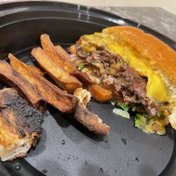 Arigna Irish Pub & Coal Fire Kitchen - Camera died (take home-day after pic) burnt pizza edges and bottom, burnt Fries (inedible) and decent burger
