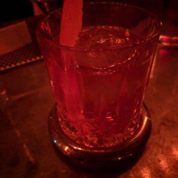 Attaboy - A moody pic of a gorgeous drink, served on a lovely silver and Crystal coaster! - Cocktail Bars Near Me - Nashville, Tennessee
