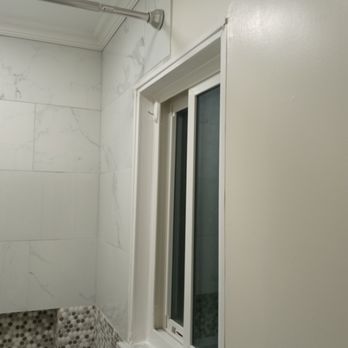 WILSON CONTRACTING - a window in a bathroom - General Contractors Near Me WILSON CONTRACTING - a window in a bathroom - General Contractors Near Me