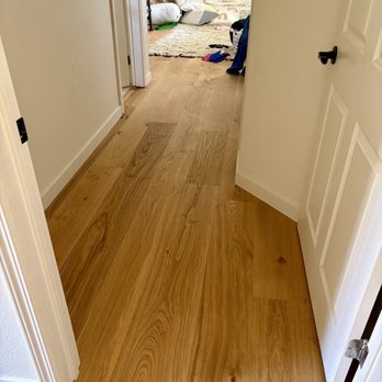 Lam's Flooring - Nasty carpet removed in another second story bedroom, beautiful 4mm engineered wood installed. - Flooring Near Me