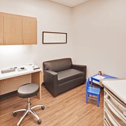 MedSpring Urgent Care - Exam rooms with flat screen TV, couch and Wi-Fi.