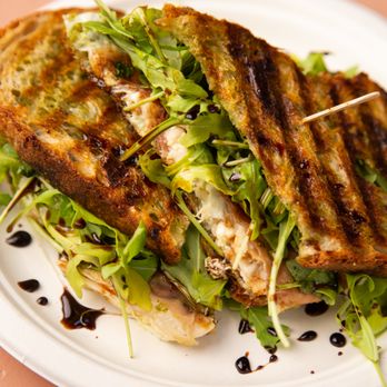 Gunther’s - The Urs. Our most popular sandwich! Rotisserie chicken, mozzarella, prosciutto, pesto, arugula, and balsamic glaze on sourdough. - Breakfast & Brunch Near Me - Ridgewood, New York Gunther’s - The Urs. Our most popular sandwich! Rotisserie chicken, mozzarella, prosciutto, pesto, arugula, and balsamic glaze on sourdough. - Breakfast & Brunch Near Me - Ridgewood, New York