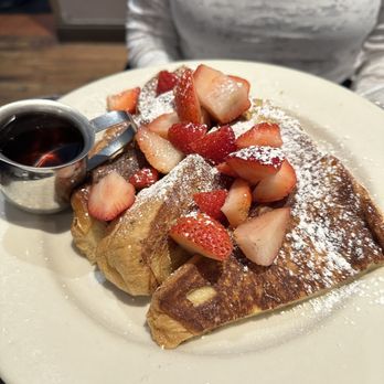 Zaftigs Delicatessen - a plate of french toast with strawberries and powdered sugar - Delis Near Me - Natick, Massachusetts Zaftigs Delicatessen - a plate of french toast with strawberries and powdered sugar - Delis Near Me - Natick, Massachusetts
