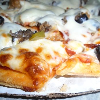 Huey's Bar - Brothers frozen pizza - Supreme - close-up. - Nightlife Near Me - New Richmond, Wisconsin Huey's Bar - Brothers frozen pizza - Supreme - close-up. - Nightlife Near Me - New Richmond, Wisconsin