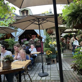 Zoubi - View of courtyard seating.  So lush and green.  Beautiful flowers throughout. - New American Near Me - New Hope, Pennsylvania