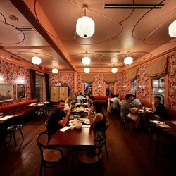 Best Quality Daughter - The restaurant has four distinct dining rooms adorned with bright colors and neon.