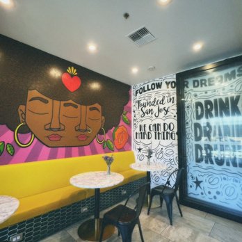 Nirvana Soul Coffee - Table and art area - Coffee & Tea Near Me - Cupertino, California Nirvana Soul Coffee - Table and art area - Coffee & Tea Near Me - Cupertino, California