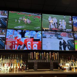 The 8 TVs over the bar, three on the same cop show