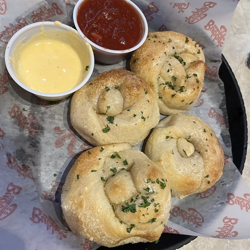 Bubba's 33 - Garlic knots - literally the BEST I've ever had. Cheese sauce is insane!! - Burgers Near Me - Fayetteville, North Carolina