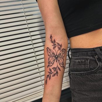 Njoy Ink Studios - Butterfly tattoo, black and grey, floral leaves arm tattoo - Tattoo Near Me - Coeurdalene, Idaho Njoy Ink Studios - Butterfly tattoo, black and grey, floral leaves arm tattoo - Tattoo Near Me - Coeurdalene, Idaho