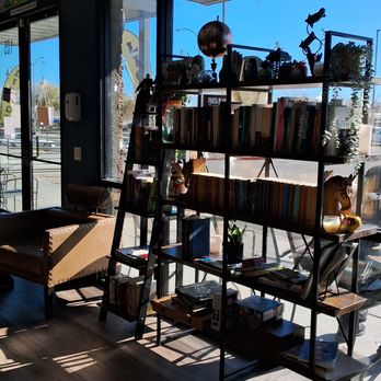 Leafs and Grounds - Book rack by window. - Coffee & Tea Near Me - Las Vegas, Nevada