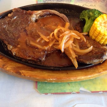 Cafe Orchid - Steak combo served on cast iron -onion selection (they also offer black pepper steak). - Chinese Near Me - Millbrae, California Cafe Orchid - Steak combo served on cast iron -onion selection (they also offer black pepper steak). - Chinese Near Me - Millbrae, California