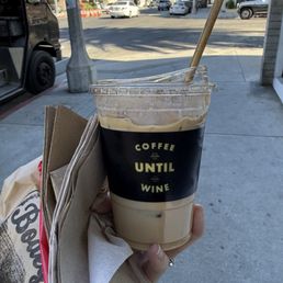 Iced churro latte to go and a blueberry scone. Iced churro latte to go and a blueberry scone.