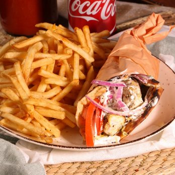 Sparta - a sandwich and french fries on a plate - Greek Near Me - Montreal, Quebec Sparta - a sandwich and french fries on a plate - Greek Near Me - Montreal, Quebec