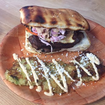 Nolanica - NolaNica burger with yucca fritters - Latin American Near Me - Saint Rose, Louisiana Nolanica - NolaNica burger with yucca fritters - Latin American Near Me - Saint Rose, Louisiana
