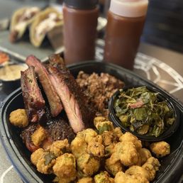 Yummy! Pork ribs and brisket combo platter with fried okra and perfectly flavored collard greens. Enough to share. Yummy! Pork ribs and brisket combo platter with fried okra and perfectly flavored collard greens. Enough to share.