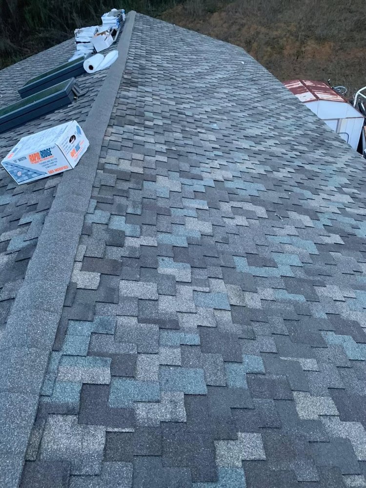 Slide of Her Construction Roofing Specialists 