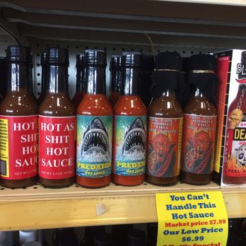 Peppers - a variety of hot sauces on a shelf - Specialty Food Near Me - Lewes, Delaware Peppers - a variety of hot sauces on a shelf - Specialty Food Near Me - Lewes, Delaware