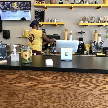 AndySunflower Café - a woman working behind the counter - Coffee & Tea Near Me - Chicago, Illinois