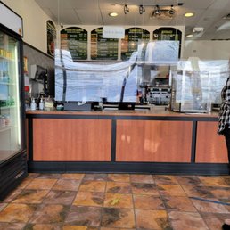 a woman standing in front of a counter