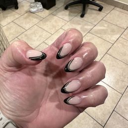 Fresh dip nails, bubble bath base with black French in almond shape. Fresh dip nails, bubble bath base with black French in almond shape.