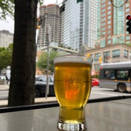 Enjoying a pilsner on the outdoor patio before going to our table inside. Enjoying a pilsner on the outdoor patio before going to our table inside.