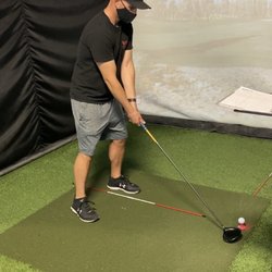 My husband learning to use the driver!