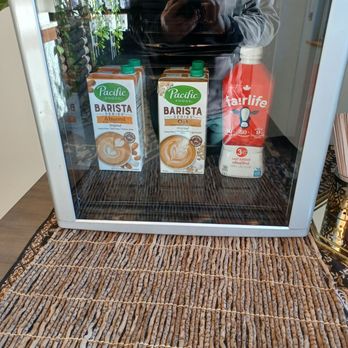 Fawkes Coffee and Doughnuts - a man standing in front of a refrigerator - Donuts Near Me - Edmonton, Alberta