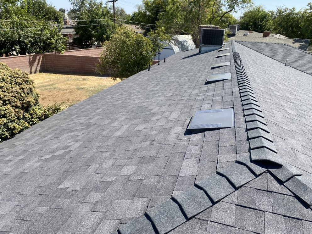 Slide of Modern Roofers and Restoration