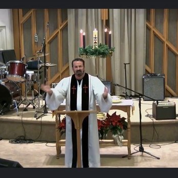 First Christian Church - Pastor Mitchell leading worship and preaching (He doesn't always wear the robe.) during Advent, see the Advent Candles! - Churches Near Me - Atchison, Kansas