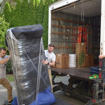 Mr. Minar's Moving Magic - 3 movers loading a heavy sofa into a box truck - Movers Near Me - Mercer Island, Washington Mr. Minar's Moving Magic - 3 movers loading a heavy sofa into a box truck - Movers Near Me - Mercer Island, Washington