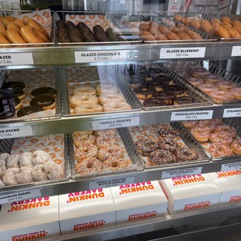 Dunkin' -  a variety of donuts in a display case - Coffee & Tea Near Me - Palatka, Florida