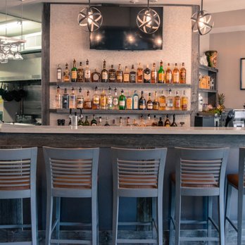 JP Restaurant - a bar with chairs and a television - Pubs Near Me - Toronto, Ontario