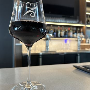 Zephyr Wine Bar - a glass of wine on a counter - Wine Bars Near Me - Reno, Nevada