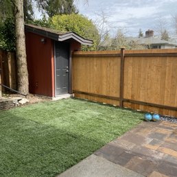 a backyard with a fence and a shed a backyard with a fence and a shed