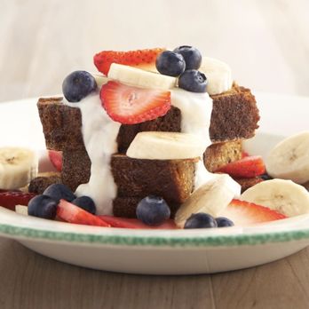 Cora - a plate of french toast with strawberries, bananas and blueberries - Breakfast & Brunch Near Me - Calgary, Alberta Cora - a plate of french toast with strawberries, bananas and blueberries - Breakfast & Brunch Near Me - Calgary, Alberta